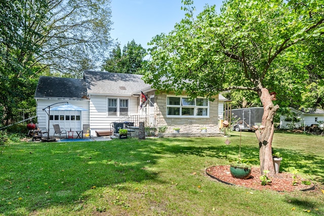 rear view of house with a yard