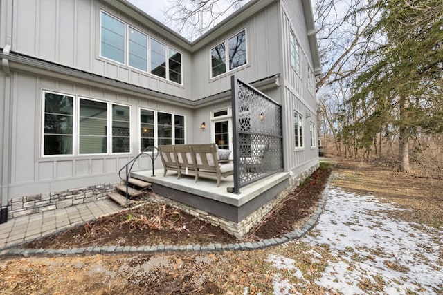 back of property with board and batten siding