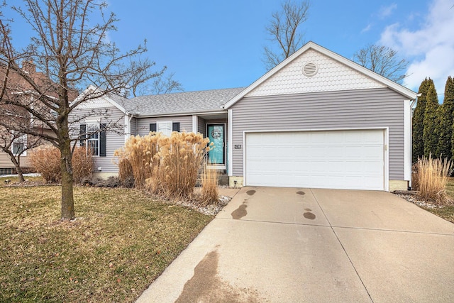 ranch-style house with a garage and a front yard