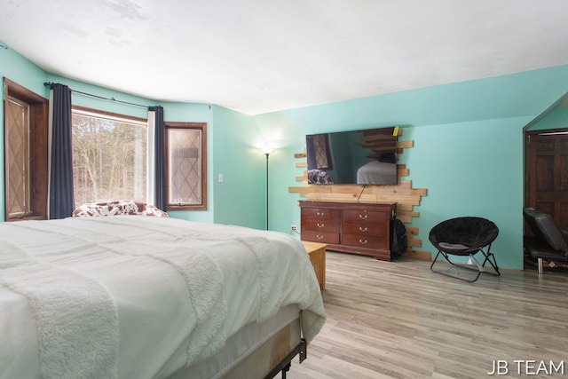 bedroom with light wood-style floors