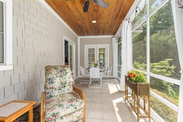 sunroom / solarium featuring wood ceiling and ceiling fan