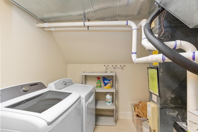 laundry area with washing machine and dryer