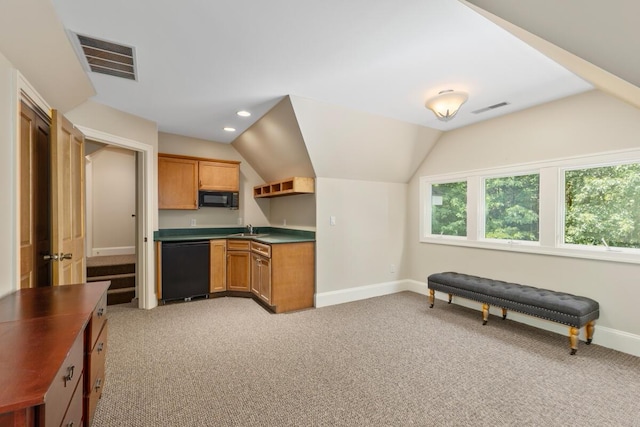 kitchen with vaulted ceiling, sink, light colored carpet, and black appliances