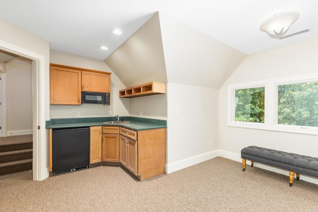 kitchen featuring light colored carpet, lofted ceiling, sink, and black appliances