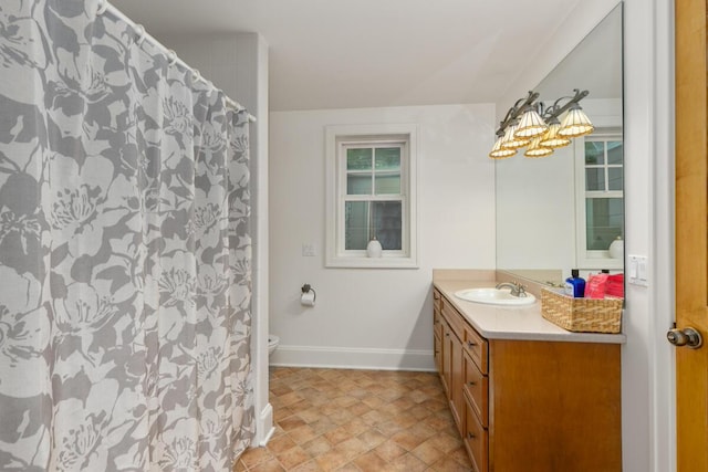 bathroom with vanity and toilet