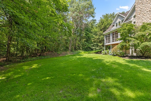 view of yard with a sunroom