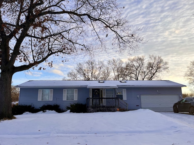 single story home with an attached garage and covered porch