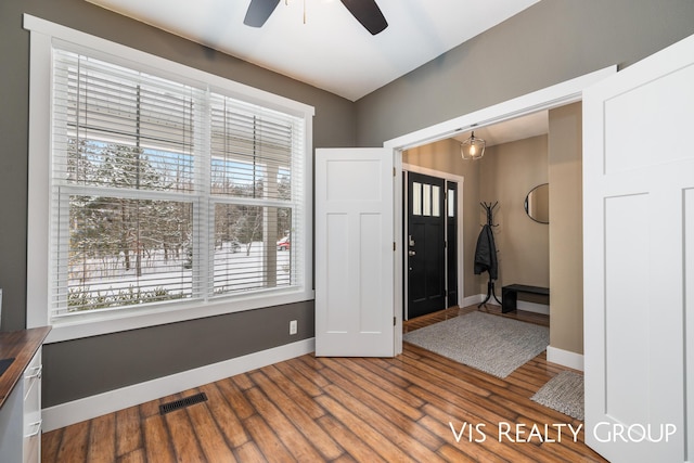 9340 Freedom Dr, West Olive, MI 49460 - entrance foyer with wood finished floors, baseboards, a ceiling fan, and visible vents