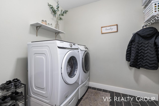 9340 Freedom Dr, West Olive, MI 49460 - laundry area with separate washer and dryer, laundry area, and baseboards