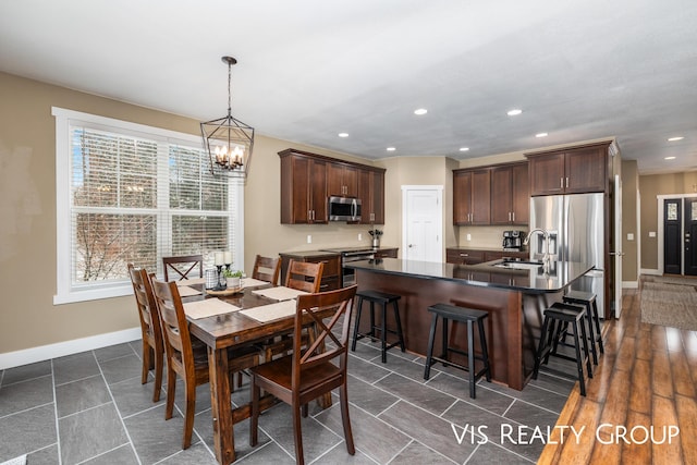 9340 Freedom Dr, West Olive, MI 49460 - dining room featuring an inviting chandelier, baseboards, and recessed lighting