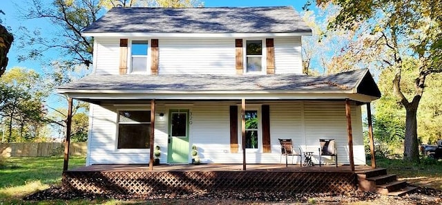 view of front of property featuring a porch and a deck