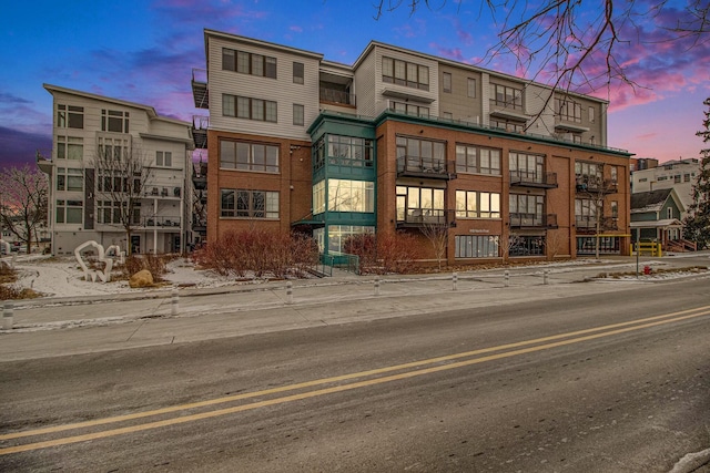 view of outdoor building at dusk