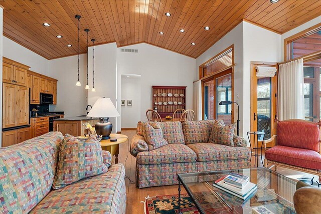 43162 Whispering Pines Path, Coloma, MI 49038 - living room with high vaulted ceiling, light wood-type flooring, visible vents, and wooden ceiling