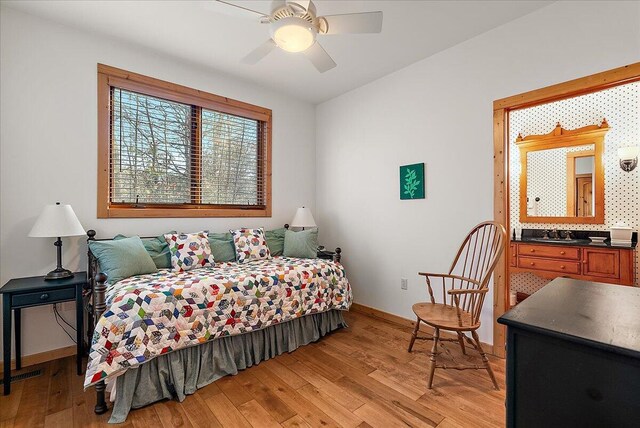 43162 Whispering Pines Path, Coloma, MI 49038 - bedroom featuring baseboards, ceiling fan, visible vents, and light wood-type flooring