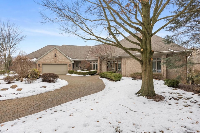 single story home featuring a garage