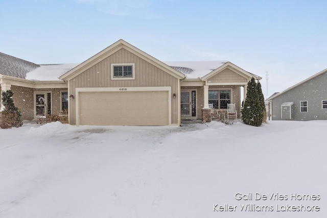 view of front of property featuring covered porch and an attached garage