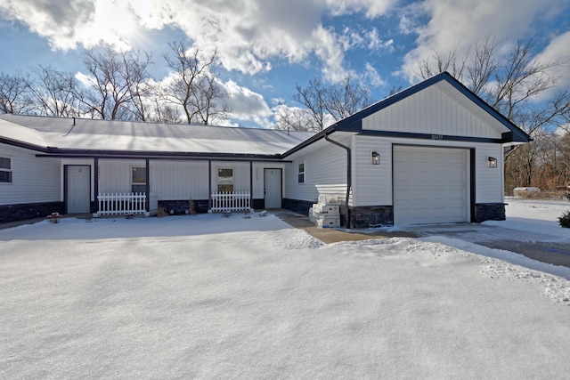 single story home with a garage and covered porch