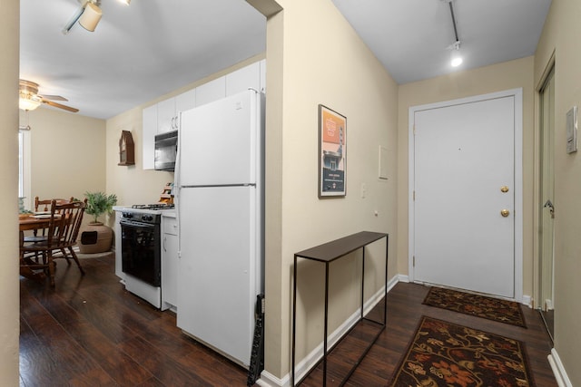 kitchen featuring dark wood-style floors, ceiling fan, white appliances, and white cabinets