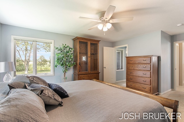 carpeted bedroom featuring ceiling fan