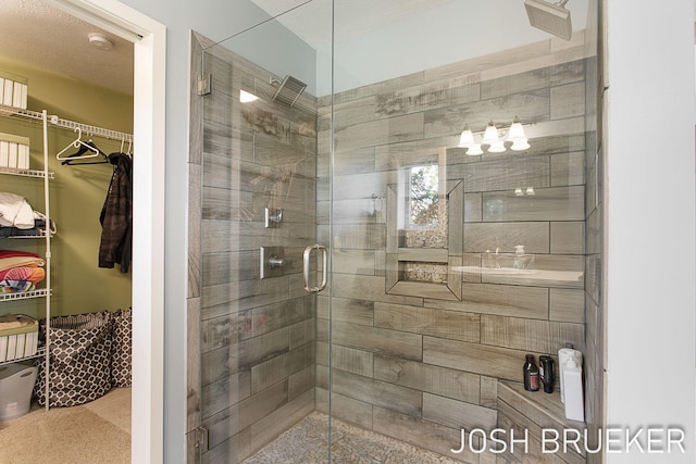 bathroom with a shower with shower door