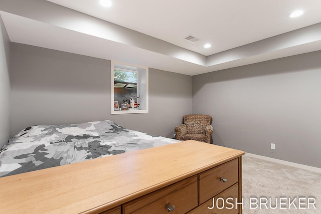 bedroom featuring light carpet