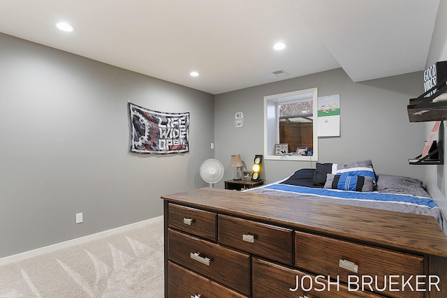 bedroom featuring light carpet