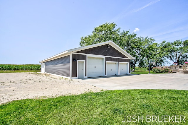 garage featuring a yard