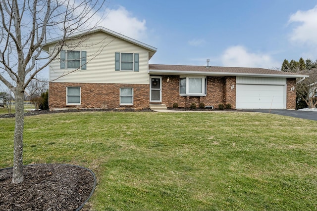 split level home with a garage and a front yard