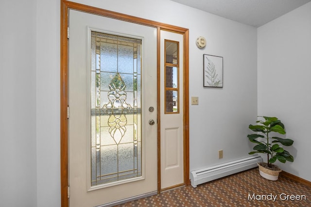 366 E Beech St NE, Cedar Springs, MI 49319 - foyer entrance featuring a baseboard heating unit and baseboards