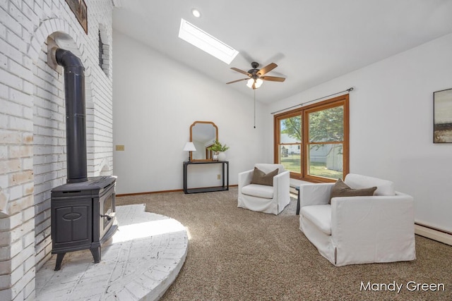 366 E Beech St NE, Cedar Springs, MI 49319 - living area with a wood stove, a ceiling fan, carpet floors, a baseboard heating unit, and high vaulted ceiling