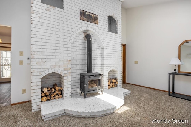 366 E Beech St NE, Cedar Springs, MI 49319 - living area with carpet and a wood stove