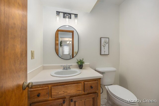 366 E Beech St NE, Cedar Springs, MI 49319 - half bathroom with vanity and tile patterned floors