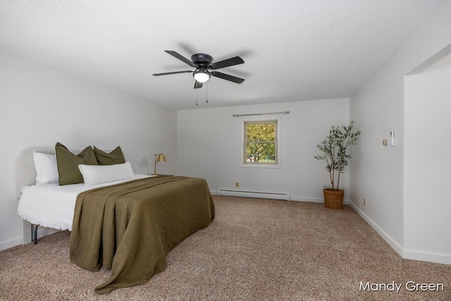 366 E Beech St NE, Cedar Springs, MI 49319 - bedroom with baseboard heating, carpet flooring, and ceiling fan