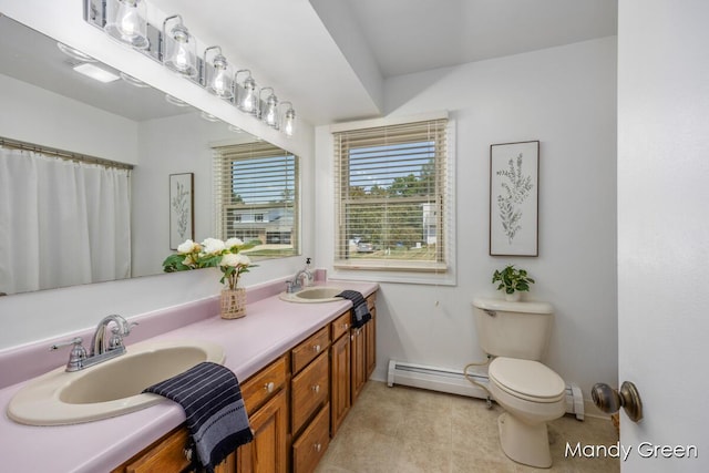366 E Beech St NE, Cedar Springs, MI 49319 - full bathroom with baseboard heating and double vanity
