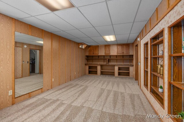 366 E Beech St NE, Cedar Springs, MI 49319 - finished basement with carpet flooring, a drop ceiling, and wood walls