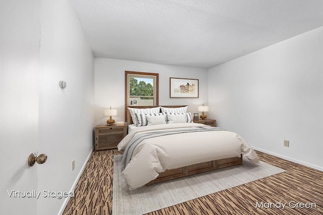 366 E Beech St NE, Cedar Springs, MI 49319 - bedroom featuring a textured ceiling and carpet flooring