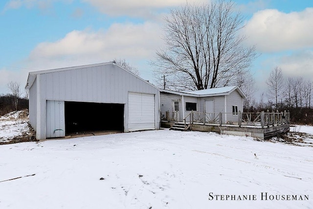 view of front facade with an outbuilding and a garage