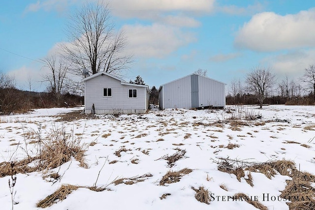 view of snow covered house