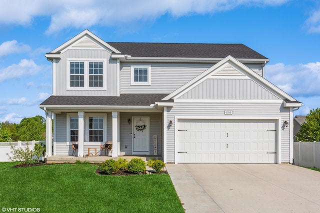 6058 Racine Dr, Stevensville, MI 49127 - view of front of home featuring covered porch, concrete driveway, board and batten siding, roof with shingles, and a garage