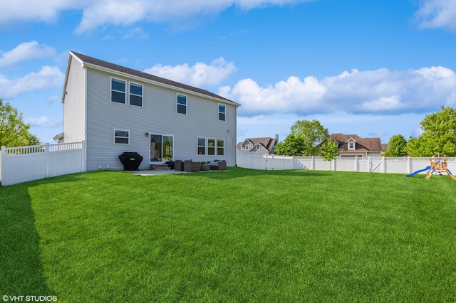 6058 Racine Dr, Stevensville, MI 49127 - rear view of house featuring an outdoor hangout area, a playground, and a patio