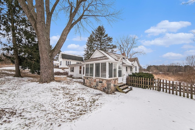 exterior space featuring a sunroom