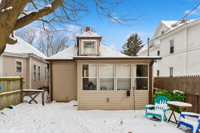 view of snow covered house