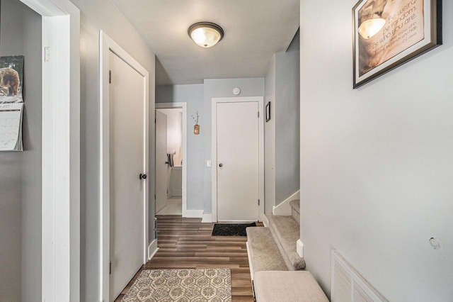 corridor featuring dark hardwood / wood-style flooring