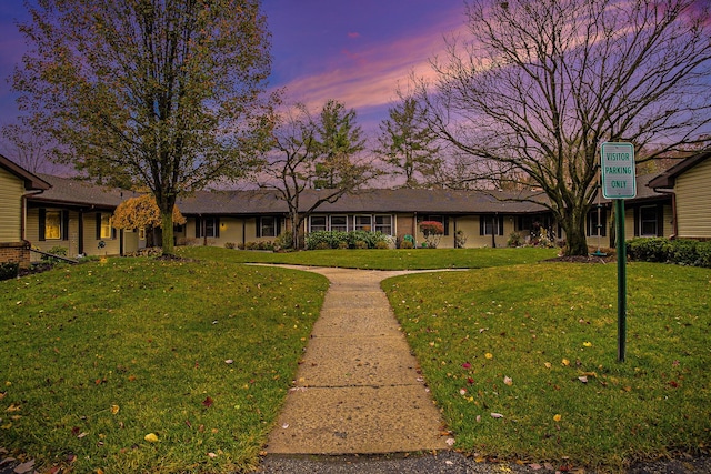 view of front of house with a lawn