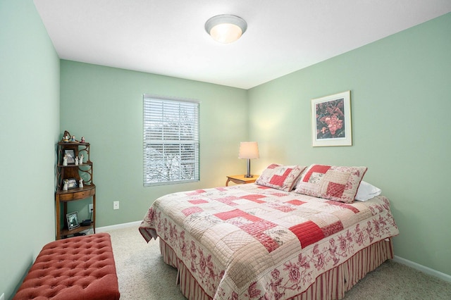 carpeted bedroom with baseboards