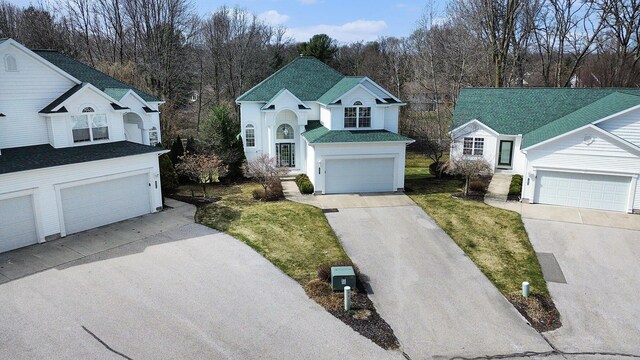 traditional home featuring a shingled roof