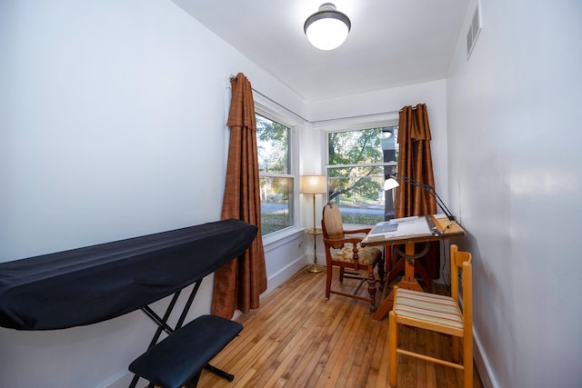 office space with light hardwood / wood-style flooring