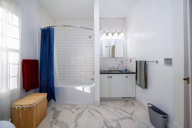 bathroom featuring vanity, shower / tub combo, and backsplash