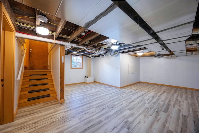 basement featuring light wood-type flooring