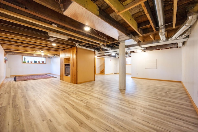 basement featuring hardwood / wood-style flooring